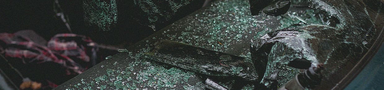 An image of a busted car window similar to what is presented in car accident settlements