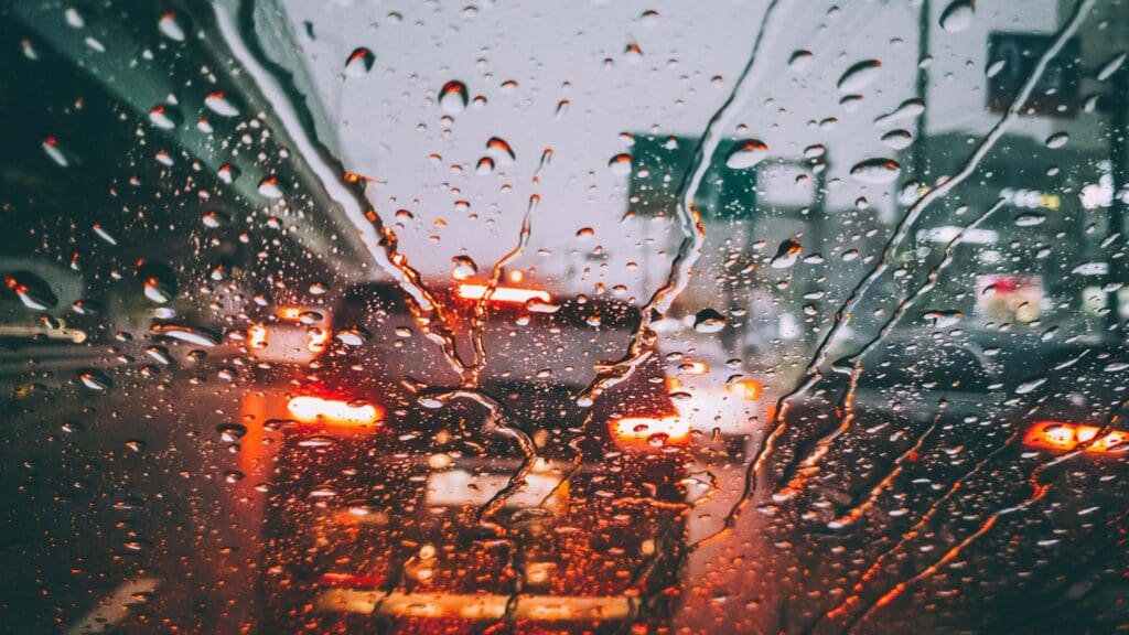 The view from behind a windshield on a rainy day