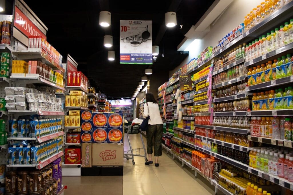 Two fully stocked aisles in a supermarket, a place where slip and fall incidents can occur
