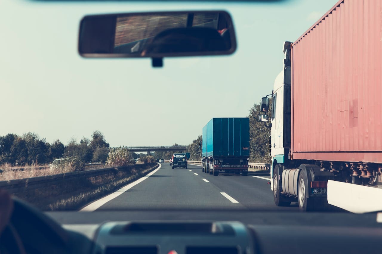 A driver keeping their distance from a semi because they know what to do after a truck accident
