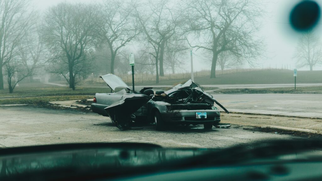 A wrecked car resulting in someone needing prompt medical attention