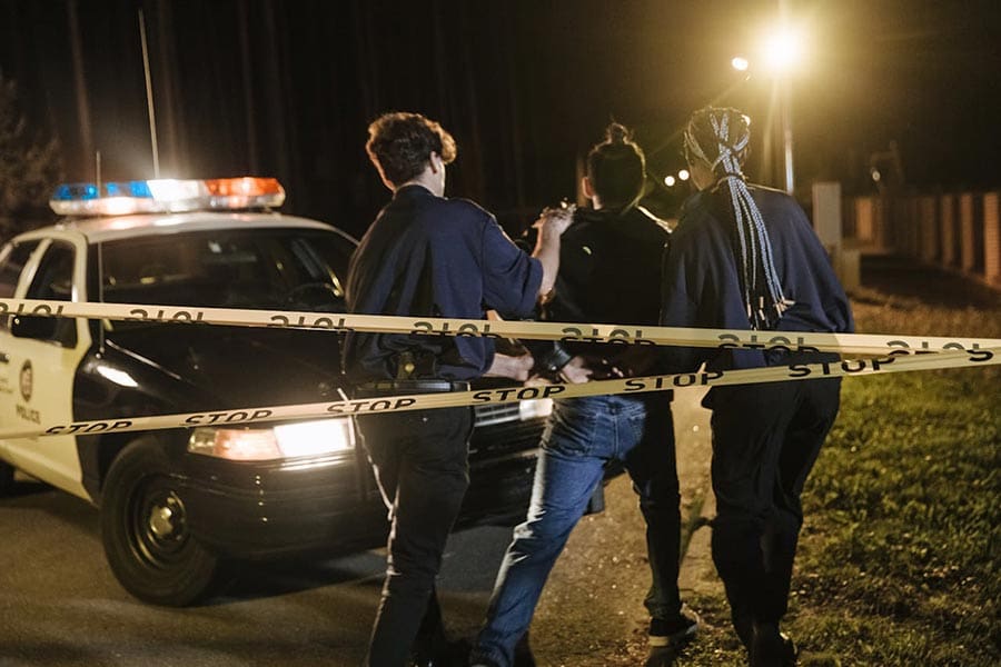 A person being arrested before facing a criminal law court case in Columbia, SC