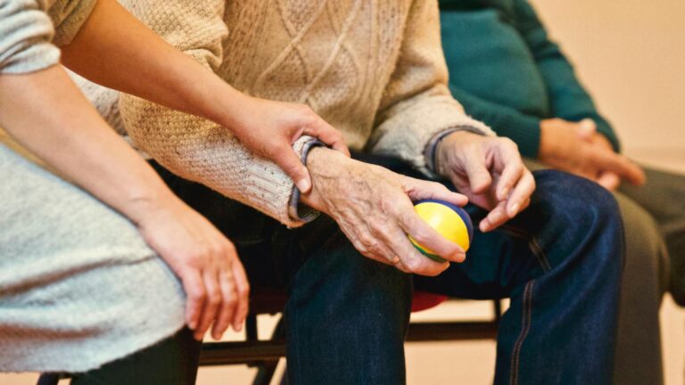 A resident sitting next to someone seeking help from a nursing home abuse attorney in Charleston, SC