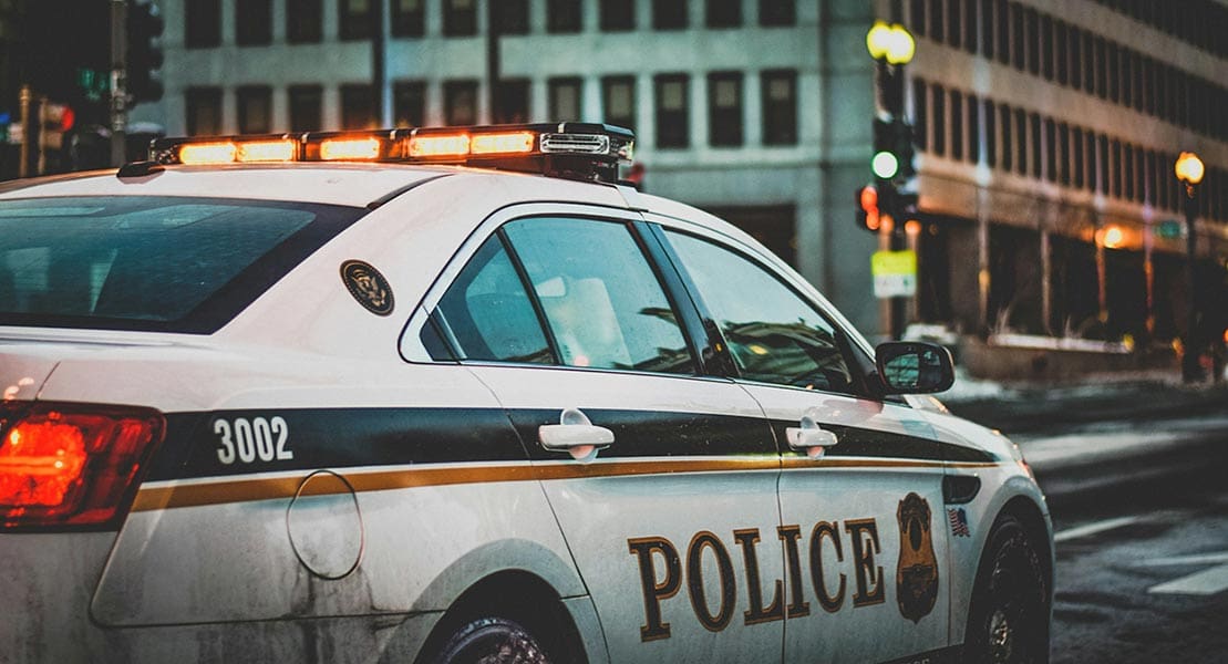 A police car parked on a city street