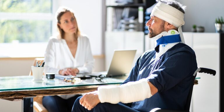 A person discussing TBI injury symptoms with a doctor