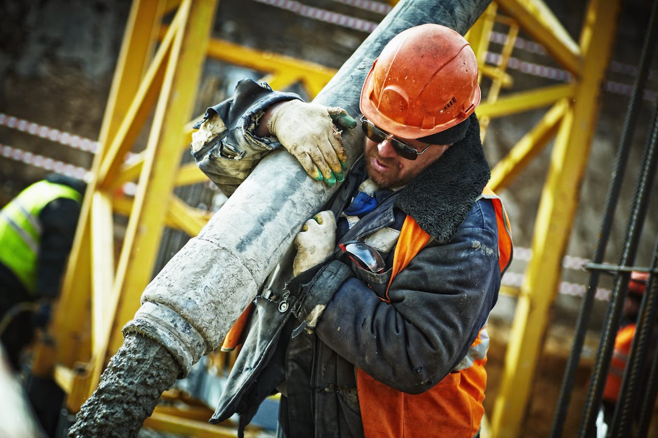A worker thinking about the best workplace injury lawyers near me after being hurt at work