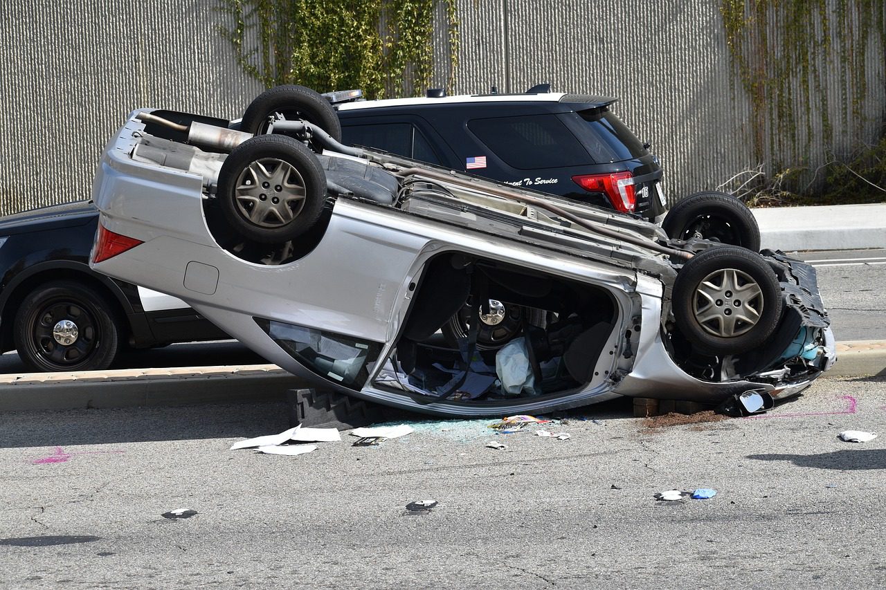 An overturned silver vehicle