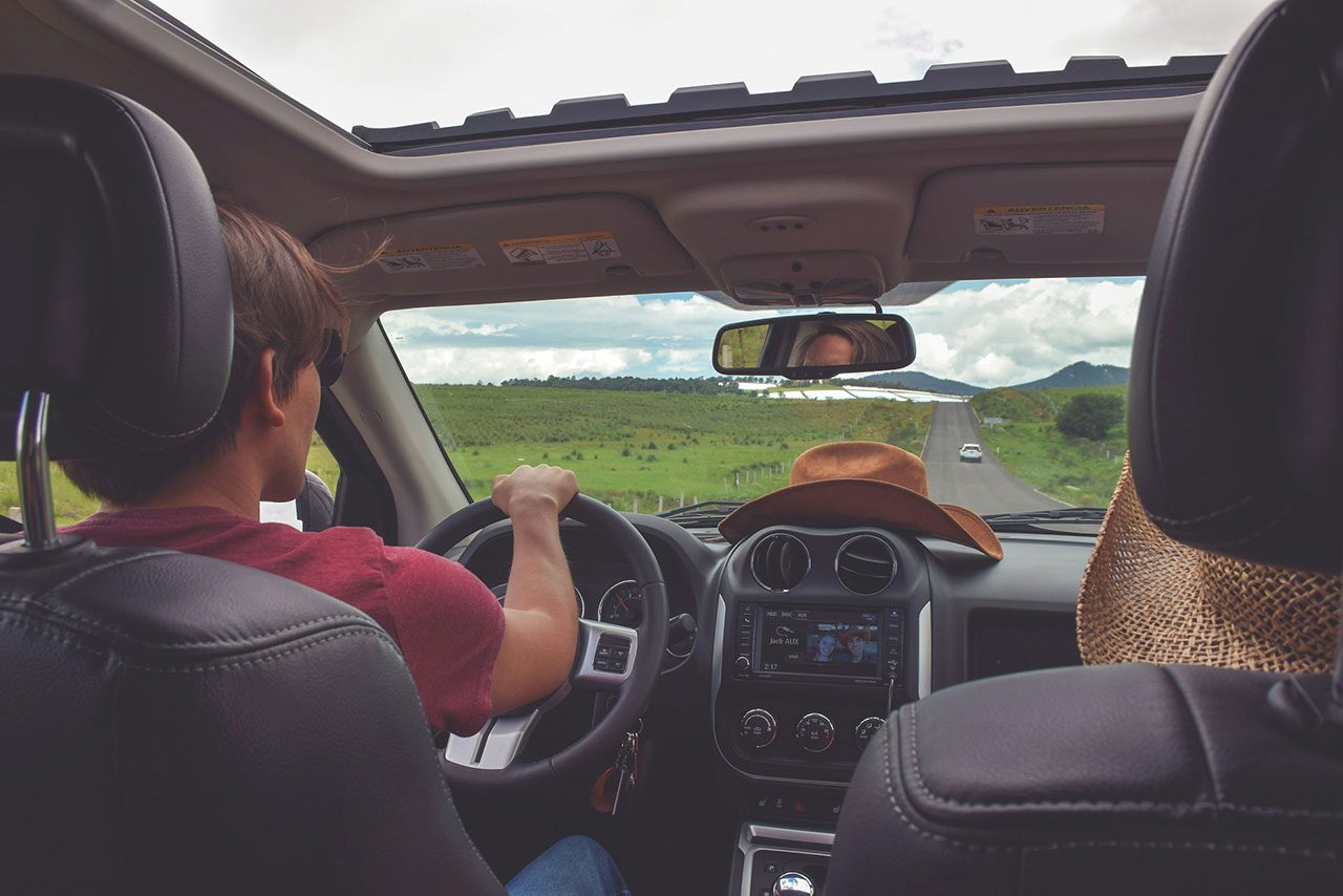 Two people driving in a car