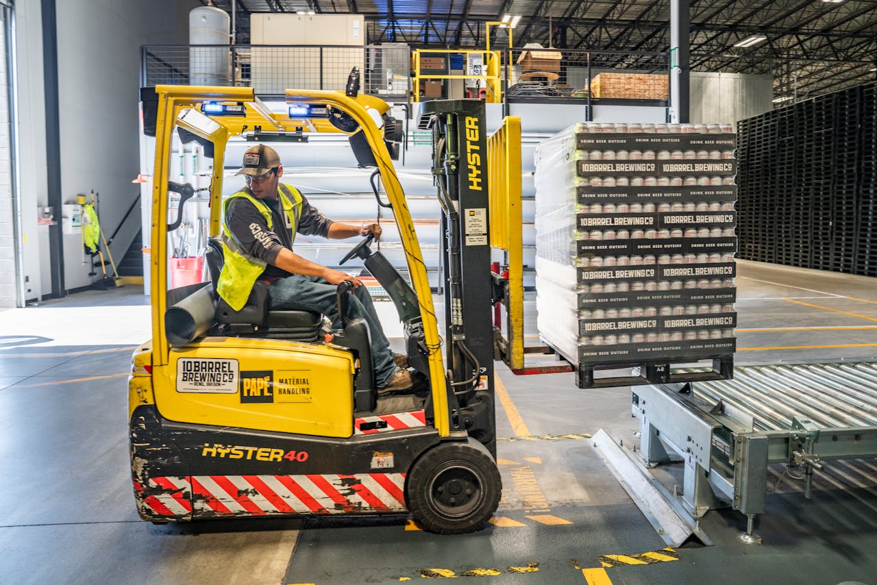 A person using a forklift before getting involved with a workers’ comp case in West Columbia