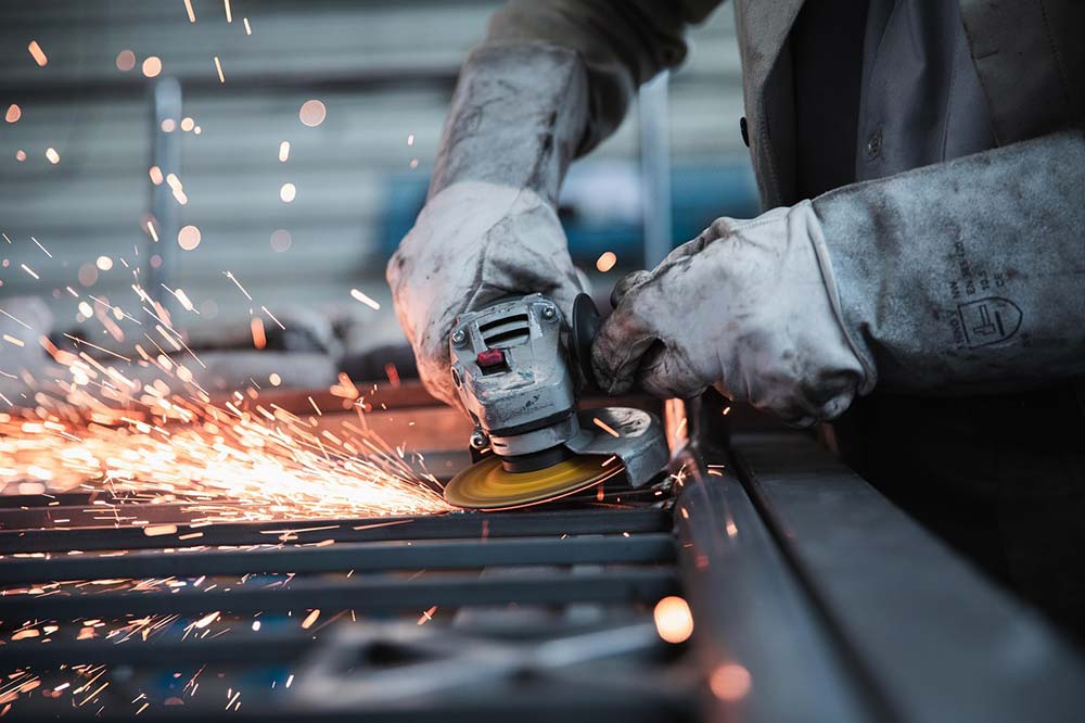 A worker using a tool before they file a workers’ comp case in Berkeley County, SC