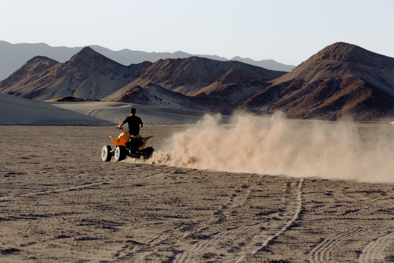 An ATV riding on the sand before an ATV and 4-wheeler accident case occurs