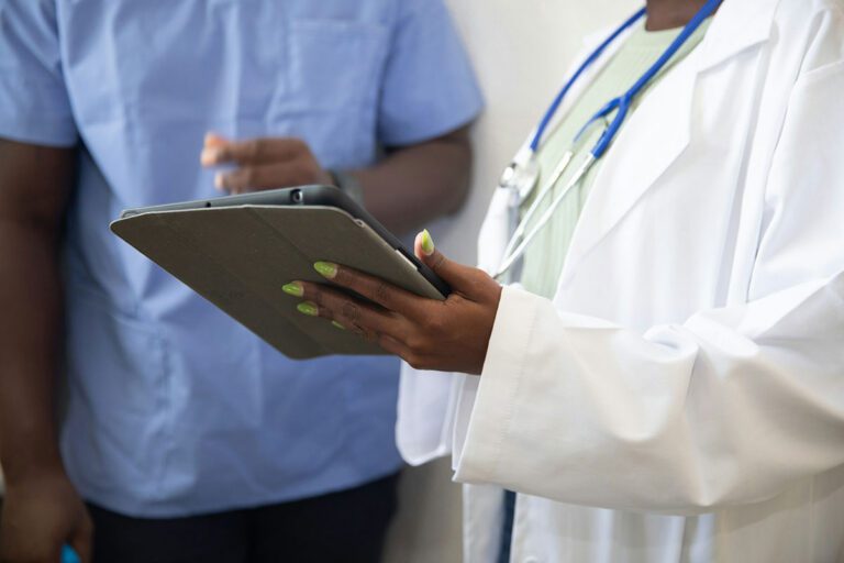 A medical professional speaking with a patient about the importance of medical records in a dog bite case