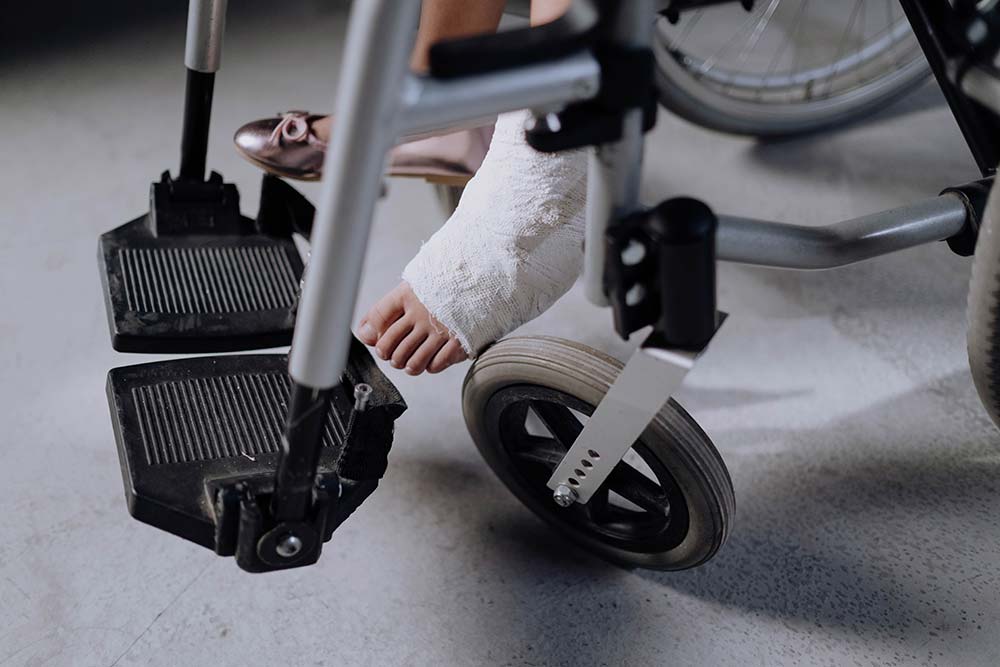 Injured person in a wheelchair, a case type handled by Greenville personal injury attorneys
